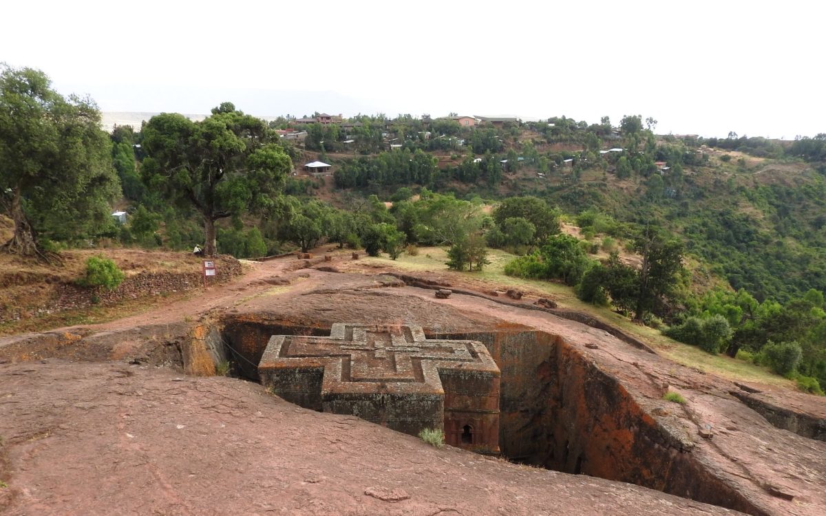 Ethiopian Orthodox rock-hewn church surrounded by vegetation at Lalibela, Ethiopia.